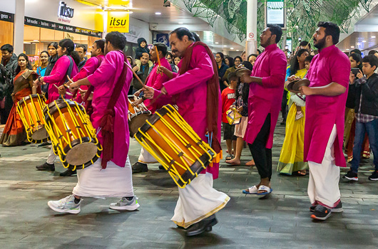 A group of drummers and percussionists are watched by a crowd as part of Woking’s Diwali celebrations